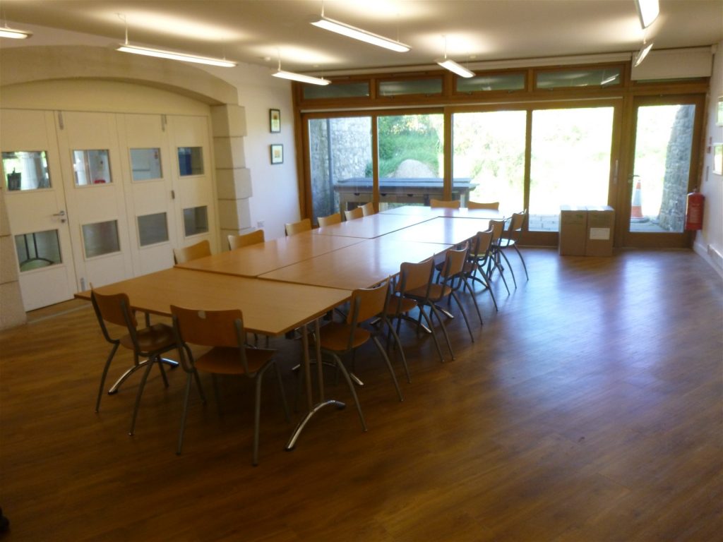 Tables and chairs in the St Davids Room, Oriel y Parc