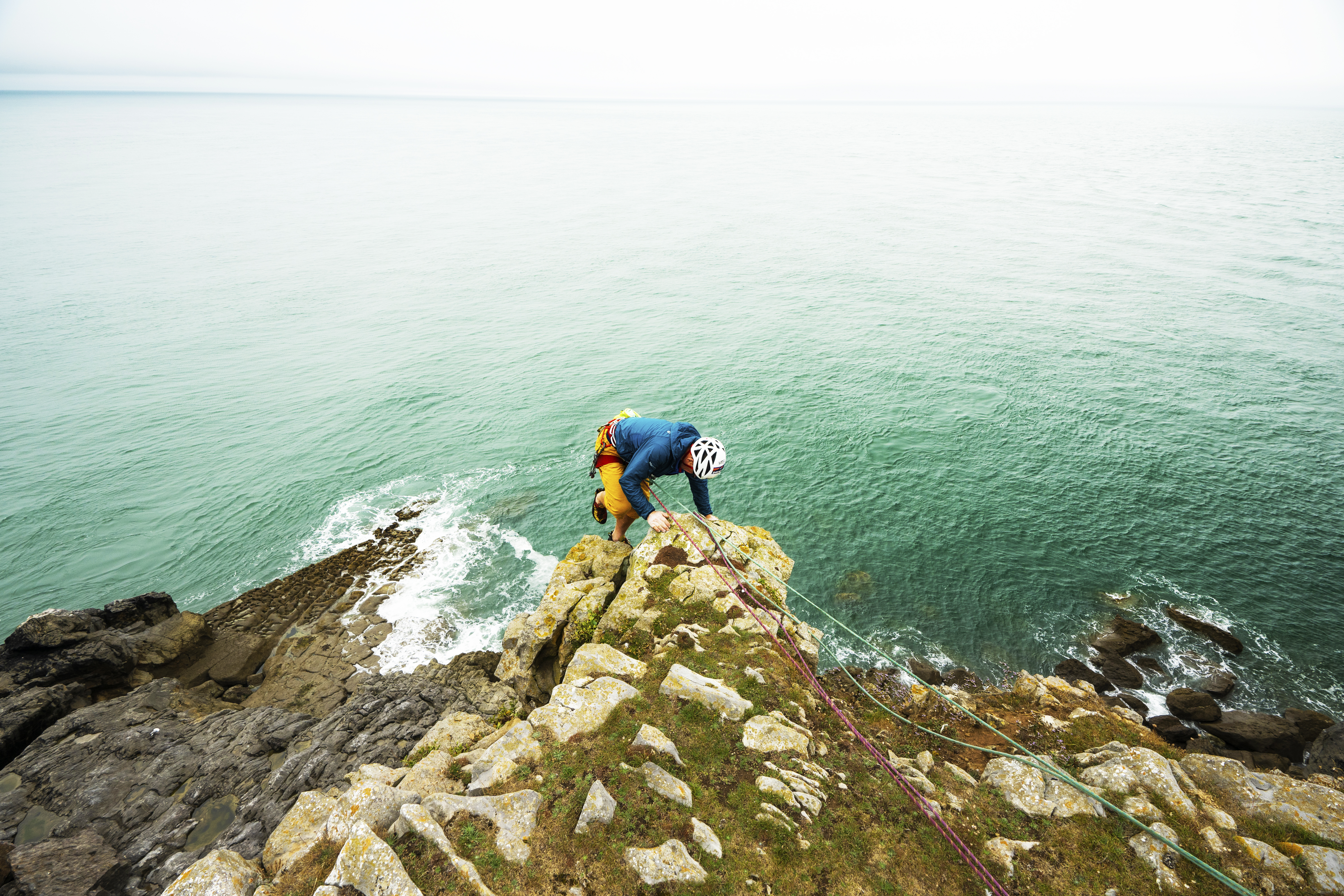 Climber at St Govan's, Pembrokeshire Coast National Park, Wales, Uk