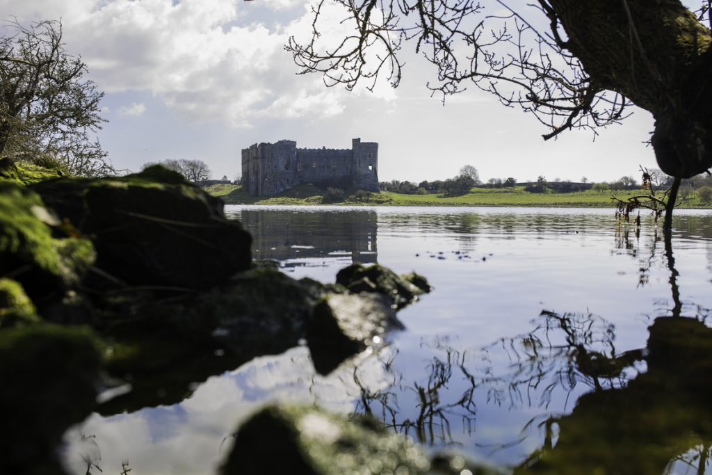 View across the Millpond to Carew Castle and Tidal Mill