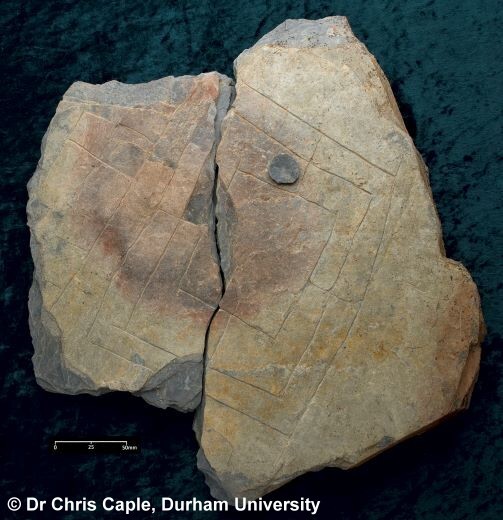 Scratches on a broken stone (Archaeological dig find 