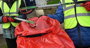 Litter picking equipment including litter picking claws and red litter bags