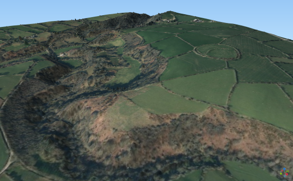 A 3D image of the Nevern Valley using lower resolution Lidar data (© Natural Resources Wales and Database Right. All rights reserved) overlaid with aerial photography (© Getmapping 2022). A circular prehistoric enclosure known as Castell Mawr can be seen above the valley. 