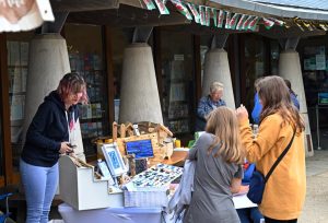 Outdoor stalls at an Oriel y Parc craft market.