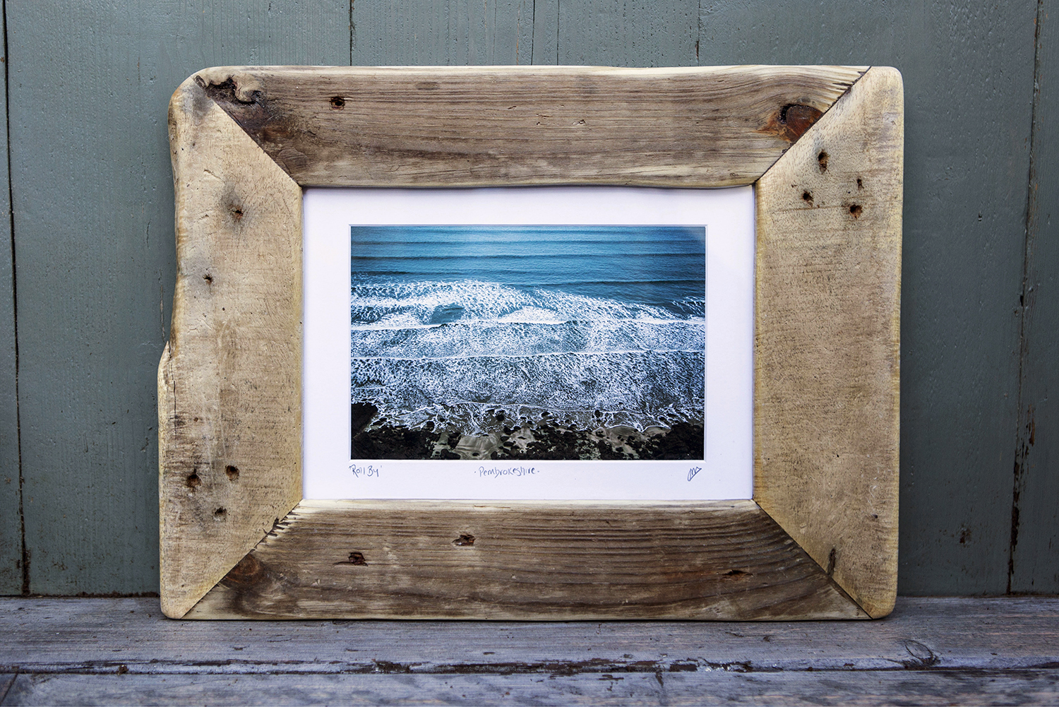 An image of a piece of art by Jen Miles in a rustic frame