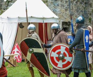 Costumed warriors with shields and helmets
