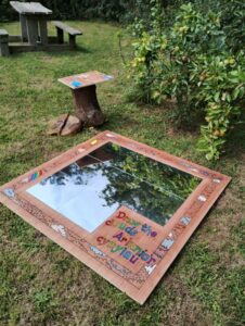 A wooden and glass structure on the Weather Wonders Trail at Oriel y Parc